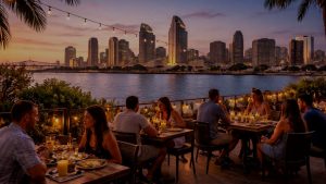 People dining along the San Diego waterfront with the downtown skyline in the background