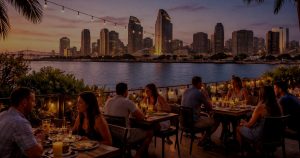 People dining along the San Diego waterfront representing local food and coastal travel experiences